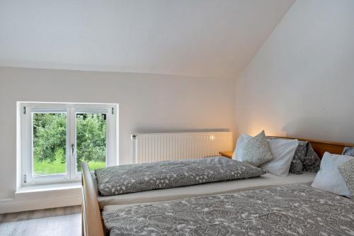 Postel nebo postele na pokoji v ubytování Ferienwohnung Flut am Weserstrand
