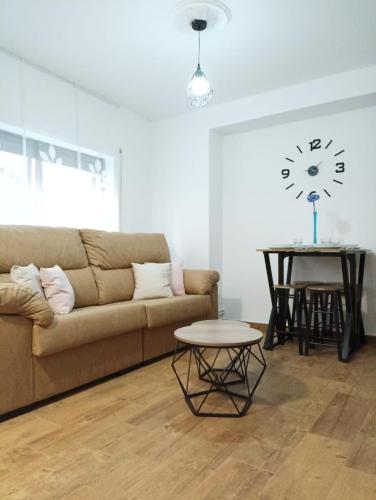 a living room with a couch and a table at Apto céntrico CASA CONCHA VUT 47-127 in Valladolid