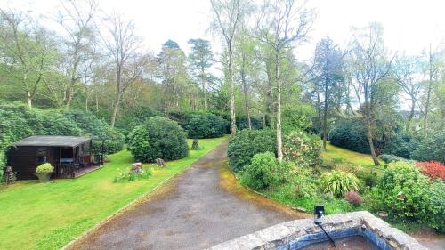 an aerial view of a garden with a house at Birchcroft Hideaway in Ferndown