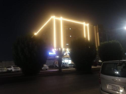 a building with lights on it at night at قصر اباهي للوحدات السكنية in Al Jubail