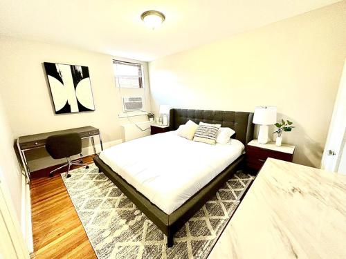 a bedroom with a bed and a chair in it at Peaceful & Perfect Private 1-br I Lennox in Philadelphia