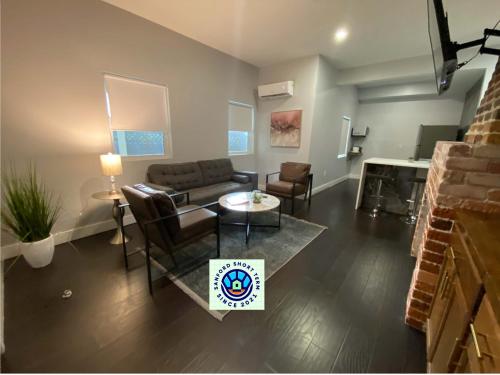 a living room with a couch and a table at The Front Porch in Sanford