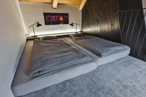 a bed with two pillows on it in a room at Just Jimramov in Jimramov