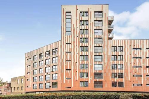 a large brick building with many windows at Unique Sky View -2 Bed Apartment in London