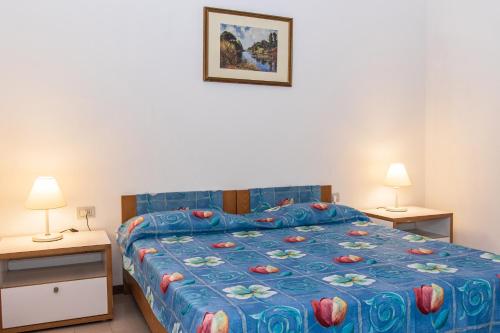 Ένα ή περισσότερα κρεβάτια σε δωμάτιο στο Borgo San Antonio & Borgo San Giuseppe by La Principina