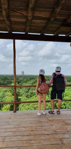 two people wearing helmets looking out over a field at Oriundo Luxury Nature Villas in Valladolid