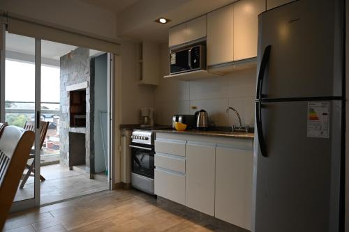 Kuchyň nebo kuchyňský kout v ubytování Costa Azul Rent Apartments
