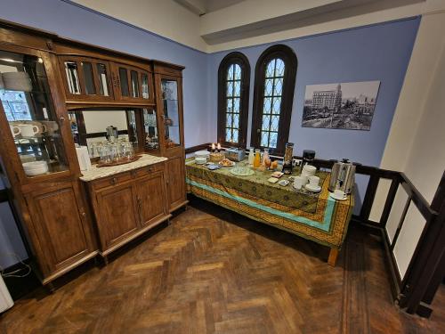 a room with a table in a room with at Nuevo Hotel Aramaya in Montevideo