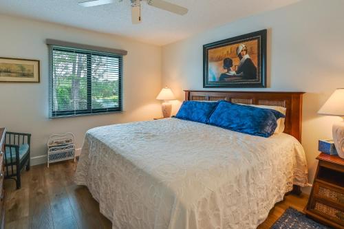 a bedroom with a bed and a painting on the wall at Naples Condo with Pool Access - 3 Mi to Beaches! in Naples