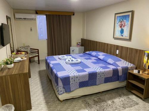 Кровать или кровати в номере Hotel Casa De Praia