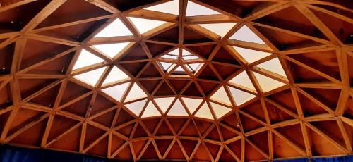 a ceiling of a room with a wooden structure at Hostal Crisol in Lo Valdés