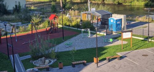 a park with a playground with at Pokoje i Apartament U Ireny in Poronin