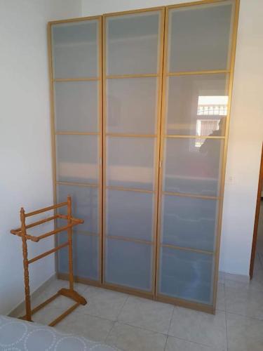 a closet with glass shelves in a room at El Rincon de Nina in La Laguna