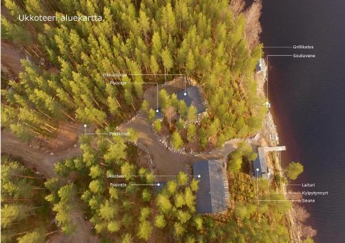 an aerial view of a forested area with a lake at Villa Ukkoteeri in Savonranta