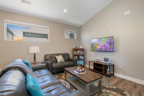 a living room with a couch and a table at Modern Midtown Home Close to Downtown in Flagstaff