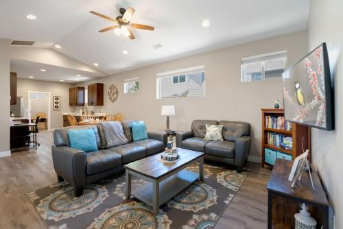a living room with a couch and a table at Modern Midtown Home Close to Downtown in Flagstaff