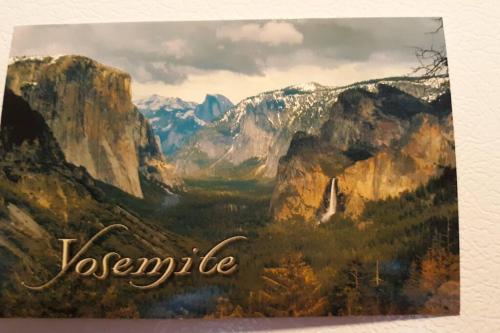 a painting of a valley in the mountains at Fairway Apartments Unit 1 in Twain Harte