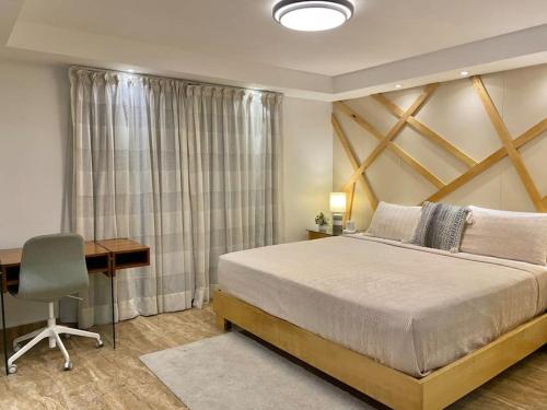 Ένα ή περισσότερα κρεβάτια σε δωμάτιο στο Lovely Sto Dgo Center Apt