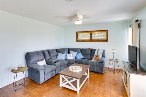 a living room with a couch and a tv at Private Beach and Dock Waterfront Panacea Retreat! in Panacea