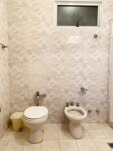 a bathroom with a toilet and a bidet at Administracion Callao in Buenos Aires