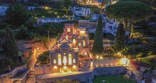 an aerial view of a mansion at night at Villa Barluzzi in Ravello