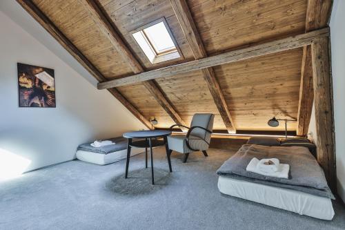 a room with a bed and a table in it at Just Jimramov in Jimramov