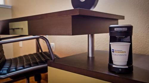 a coffee maker sitting on a counter in a hotel room at Best Western Fallon Inn & Suites in Fallon