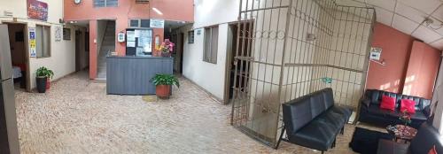 an empty hallway of a building with a lobby at Hotel Casa Real 2 in Popayan