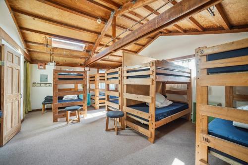 a room with a bunch of bunk beds at Limantour Lodge in Point Reyes Station