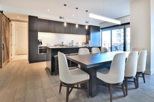 a kitchen and dining room with a table and chairs at Lift Park City Condominiums in Park City