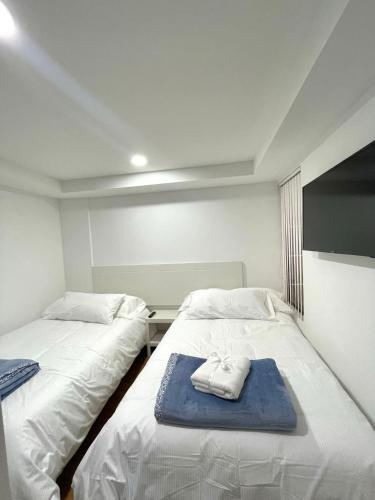 En eller flere senge i et værelse på COMODO ALOJAMIENTO EN PASTO