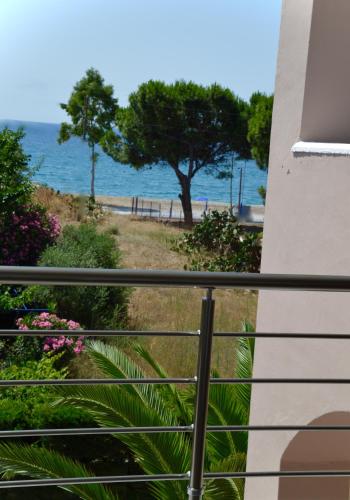 a balcony with a view of the beach at Diamond Palace in Gythio