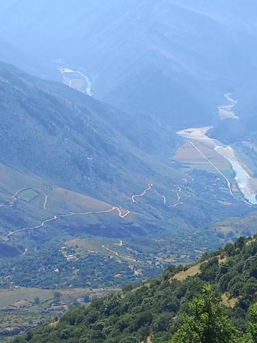 a view of a valley with a river and a mountain at VILA CANI in Tepelenë