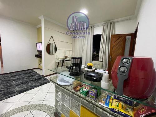 a coffee maker on a counter in a hotel room at Apto Conquista Imóveis exclusivo para Booking in Vitória da Conquista