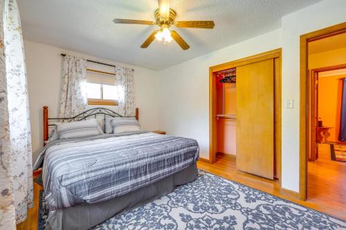 a bedroom with a bed and a ceiling fan at Pet-Friendly Waterloo Abode with Deck! in Waterloo