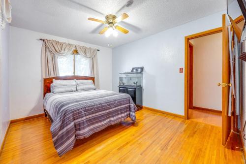 a bedroom with a bed and a ceiling fan at Pet-Friendly Waterloo Abode with Deck! in Waterloo
