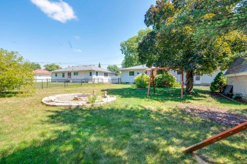 a yard with a tree and a house at Pet-Friendly Waterloo Abode with Deck! in Waterloo