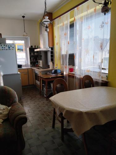 a kitchen with a table and a table and a kitchen with a tableablish at Ferien-u. Monteurwohnung ganze Unterkunft in Schieder- Schwalenberg in Schieder-Schwalenberg