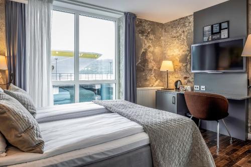 En eller flere senger på et rom på Quality Hotel Waterfront