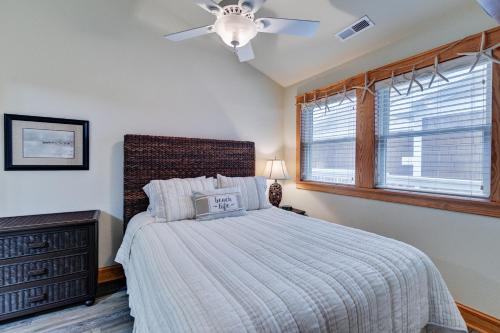 a bedroom with a bed and a ceiling fan at C309 - Sounds Good 309 in Nags Head