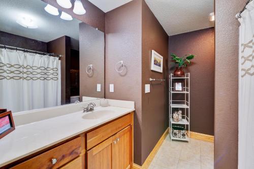 a bathroom with a sink and a shower at C309 - Sounds Good 309 in Nags Head