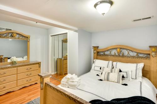 a bedroom with a large bed and a mirror at Cozy Albany Vacation Rental about 5 Mi to Downtown! in Albany