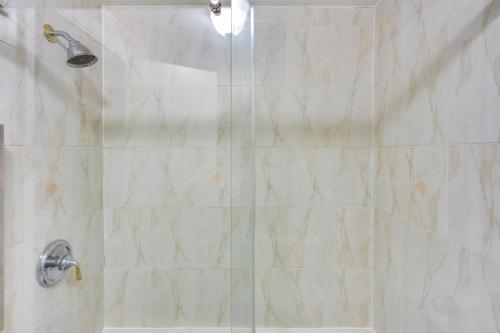 a bathroom with a shower with a glass door at Cozy Albany Vacation Rental about 5 Mi to Downtown! in Albany