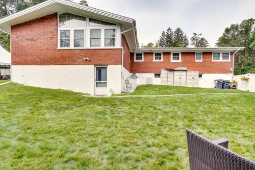 a house with a large lawn in front of it at Cozy Albany Vacation Rental about 5 Mi to Downtown! in Albany