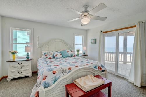 a bedroom with a bed and a ceiling fan at 7048 - Tide Song by Resort Realty in Rodanthe