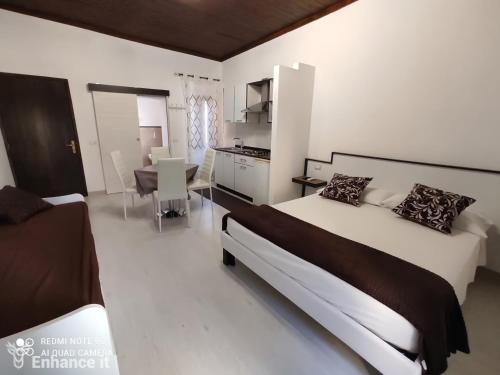 Ένα ή περισσότερα κρεβάτια σε δωμάτιο στο Tropea Travel's House