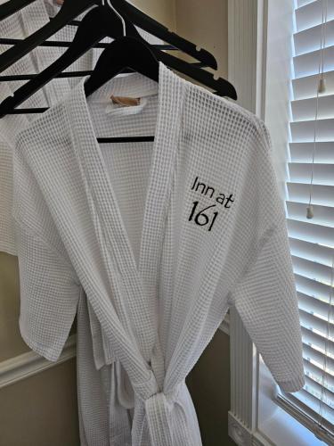 a white shirt hanging on a hanger next to a window at The Inn at 161 in Sutter Creek