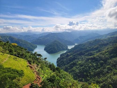 a view of a river in the mountains at AVANI Boutique Hotel in Norcasia