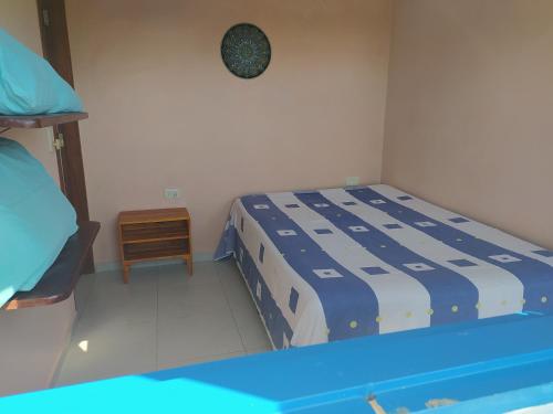 Postel nebo postele na pokoji v ubytování Sítio Iananda Suite azul