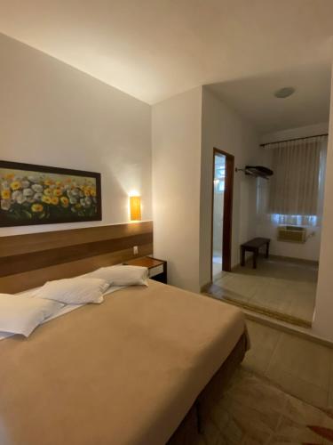 Katil atau katil-katil dalam bilik di Hotel La Ponsa Itatiaia